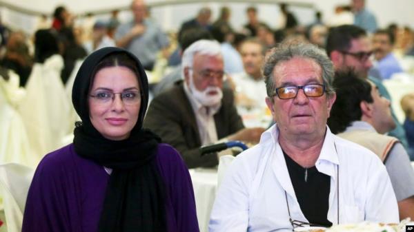 In this photo taken on July 7, 2015, and provided by the Iranian Students' News Agency, ISNA, Iranian film director Dariush Mehrjui and his wife Vahideh Mohammadifar attend a film directors' meeting in Tehran, Iran.